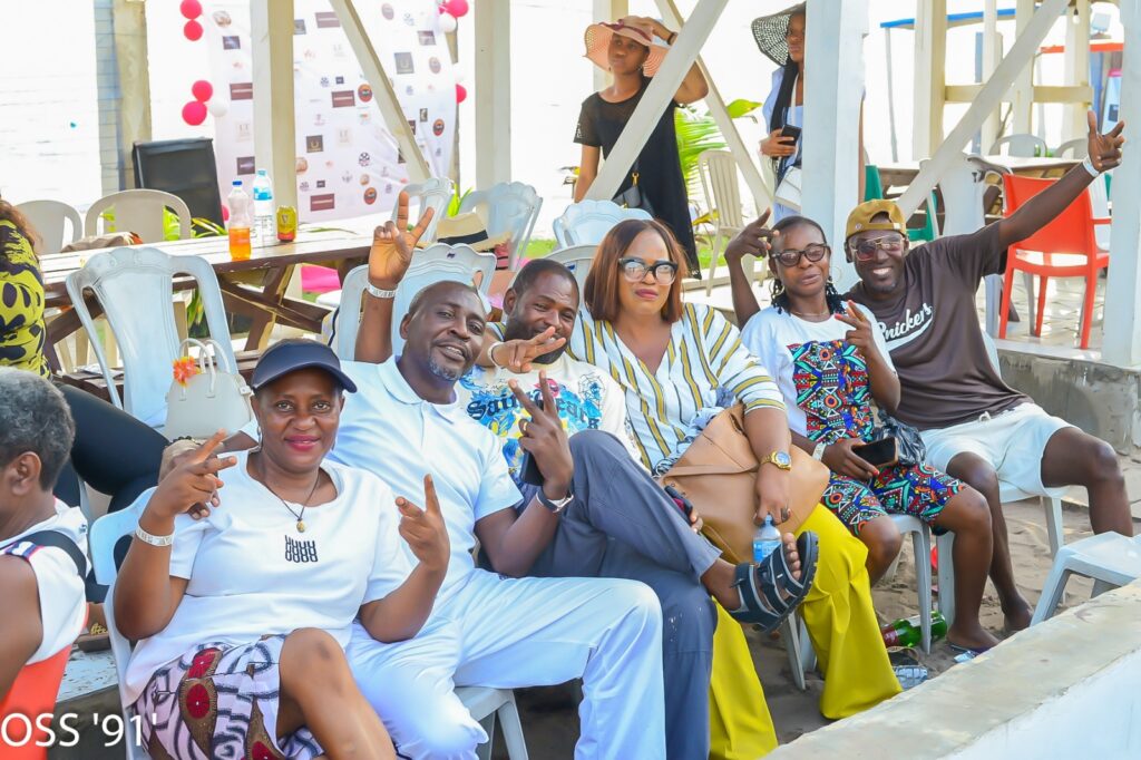 OREOSA92 members seated together and posing cheerfully at an outdoor social gathering
